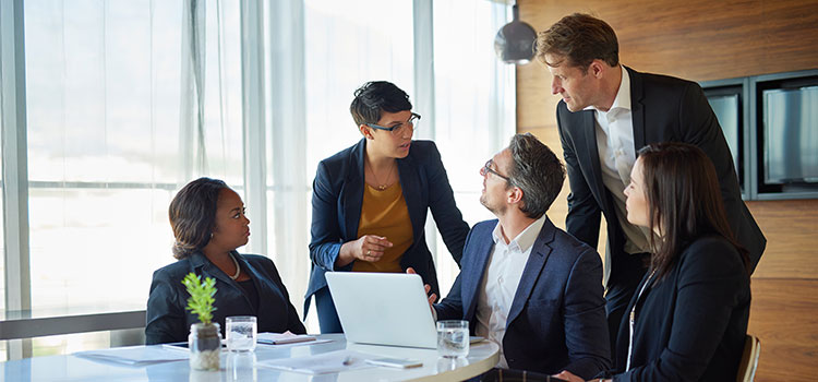 group of technology officers meet with management team